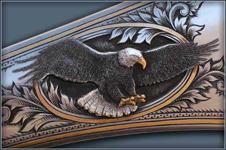 A bald eagle - with gold and platinum highlights - on an 1877 Sharps rifle.