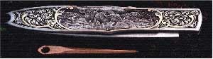 Another knife featuring cape buffalo.